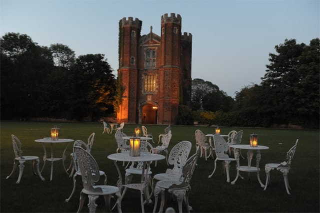 Candle lit tables at Leez Priory