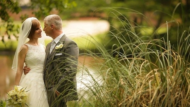 A couple by the lake at Leez Priory