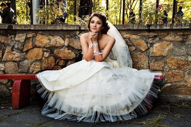 Bride sitting in her wedding dress